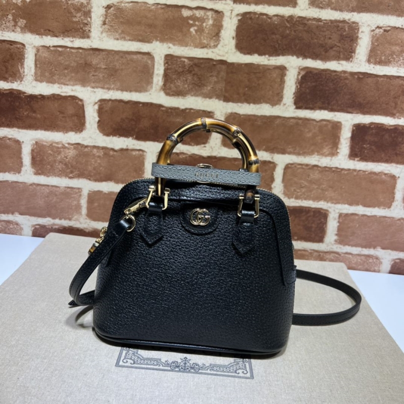 G*u*i top handle bags
